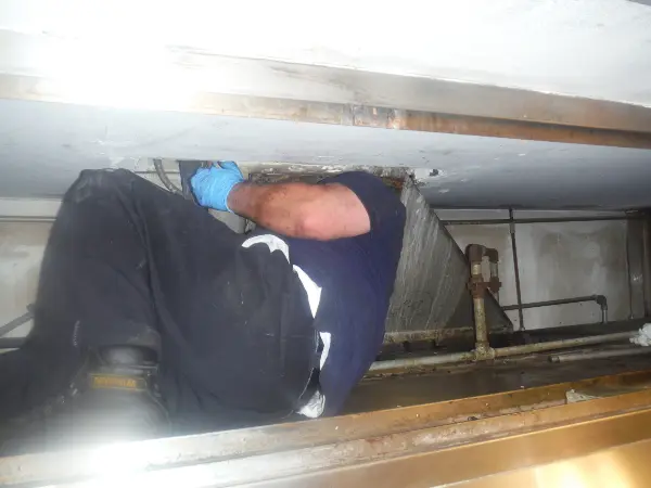 technician in vertical plenum - before